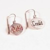 debit-credit-symbology-lois-wagner-earrings a