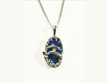 Dolphins are the guardians of the waters. They remind us to breathe deeply and feel deeply. Set with a blue stone of the waters.